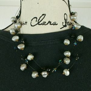 Gray & iridescent beaded necklace on dark wires